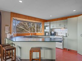 A kitchen with cabinets and appliances at JOE'S Getaway - Omori Holiday Home in Omori