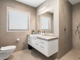 A bathroom with a sink and shower at Sunbrae Sands - Mount Maunganui Holiday Homes, Mount Maunganui