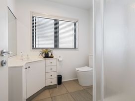 A bathroom with a sink and toilet at Sunbrae Sands - Mount Maunganui Holiday Homes