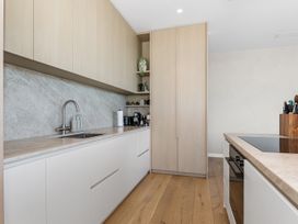 A kitchen with a sink, countertop and appliances at Langs Beach Holiday Home in Langs Beach