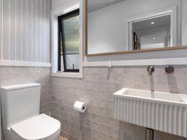 A bathroom with a toilet and sink at Langs Beach Holiday Home in Langs Beach