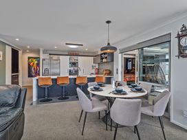 A dining area with a table and chairs at Endeavour Oasis - Whitianga Holiday Home Whitianga