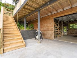 An outdoor area with stairs and a grill at Skipper’s view - Onemana Holiday Home in Onemana