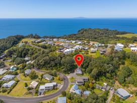 An aerial view of a coastal neighborhood with houses and trees at Skipper’s view - Onemana Holiday Home Onemana