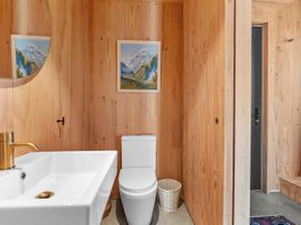 A bathroom with a sink and toilet at Peak Perspective - Wanaka Holiday Home, Wanaka