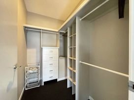 A closet with shelves and drawers at Vinnie’s haven - Opunake Holiday Home