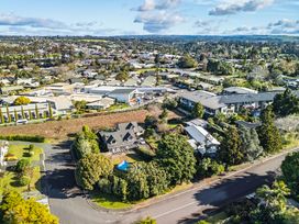 An aerial view of a residential area in a town with houses and trees at Hawkings Lodge - Kerikeri Holiday home Kerikeri