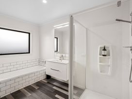 A bathroom with a sink, shower, and bathtub at Hosking Haven - Cromwell