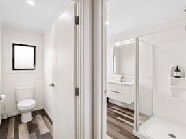 A bathroom featuring a toilet, sink, and shower at Hosking Haven - Cromwell