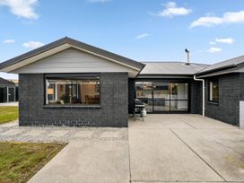 An outdoor view of a house with a patio at Hosking Haven - Cromwell