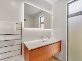 A bathroom with a sink and towel rack at Sunny Deck Haven - Richmond