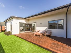 An outdoor area with a deck and chairs at Sunny Deck Haven - Richmond