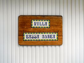 A sign with Villa Bassa Marea at Slice of paradise - Whangamata Holiday Home Whangamata
