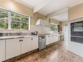 A kitchen with a sink and countertop at The Bay house - Moetapu Holiday Home