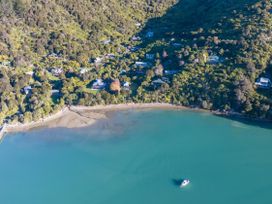 An aerial view of houses near the beach at The Bay house - Moetapu Holiday Home Moetapu Bay