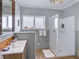 A bathroom with a washbasin and shower at Garden Grove - Kapiti Coast Holiday Home, Kapiti Coast