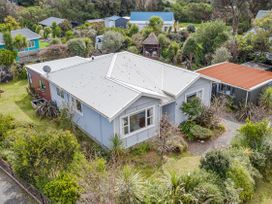 A house with garden and trees at Garden Grove - Kapiti Coast Holiday Home Kapiti Coast