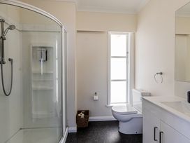 A bathroom with shower and toilet at Home away from Home - Levin Holiday Home in Foxton