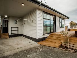 An outdoor area with steps leading to a house at Southern Base - Te Anau Holiday Home in Te Anau