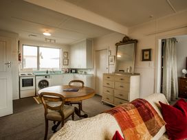 A kitchen with a table and chairs at Southern Base - Te Anau Holiday Home in Te Anau