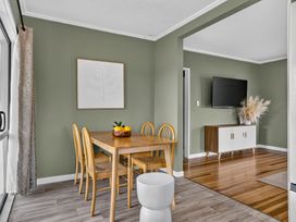 A dining room with a table and chairs at Surf House - Mangawhai Heads Holiday Home Mangawhai Heads