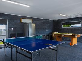 A game room with a ping pong table and pool table at Natives Nest - Karikari Peninsula