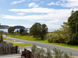 A view of the sea and trees at Natives Nest - Karikari Peninsula