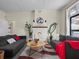 A living room with sofas and a coffee table at Cozy Family Home - Manukau City Holiday Home Manukau City