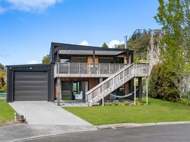 A house with garage and deck at The Cove Escape - Cooks Beach