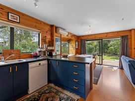 A kitchen with a sink and dishwasher at Lakeside on Te Waaka - Kuratau