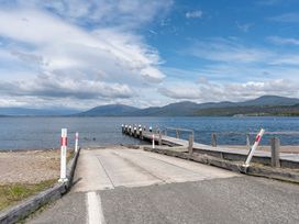 A boat ramp leading to water and a pier at Lakeside on Te Waaka - Kuratau Holiday Home, Kuratau