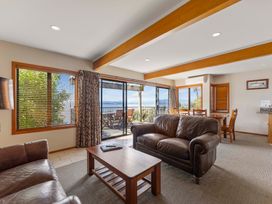 A living room with a sofa and coffee table at Fern View - Pukawa Bay Holiday Home, Pukawa Bay