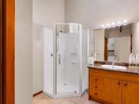 A bathroom featuring a shower and vanity with sink at Fern View - Pukawa Bay Holiday Home, Pukawa Bay