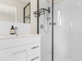 A bathroom with sink and shower at Over the Paddock - Waipu