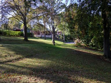 A park area with trees and a pathway at Daffodil Lodge in Saltburn-by-the-Sea
