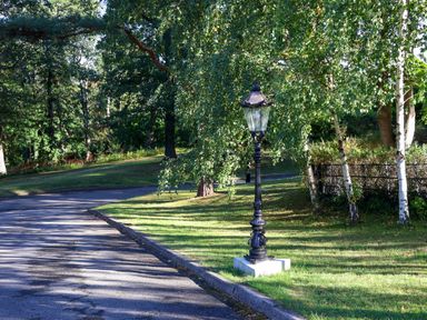 A street scene with a lamp post and trees in a park at Daffodil Lodge Saltburn-by-the-Sea