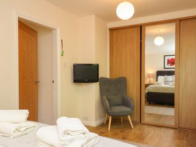 A bedroom with towels on a bed at Orchid Lodge in Saltburn-by-the-Sea