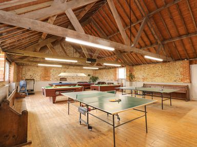 A games room with ping pong tables and pool tables at The Dairy Barn in Toftrees near Fakenham