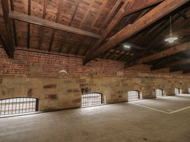 An indoor space with exposed brick and stone walls at Evening Star @ Engine Shed in Whitby