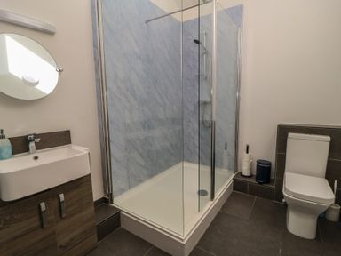 A bathroom with a shower, sink, and toilet at Dale Barton in Wells