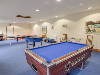 A game room with a pool table foosball table and table tennis at Manor Farm Barn in Dewlish