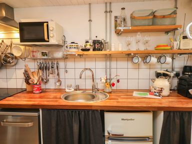 A kitchen with a sink and utensils at Farmhand Cottage near Narberth