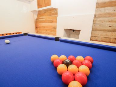 A pool table with balls arranged in a triangle at Labour in Vain St Ives