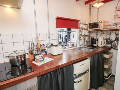 A kitchen with a wooden countertop and appliances at Grain Store near Narberth