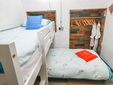 A bedroom with a bunk bed and a mattress at Cattle Shed near Narberth