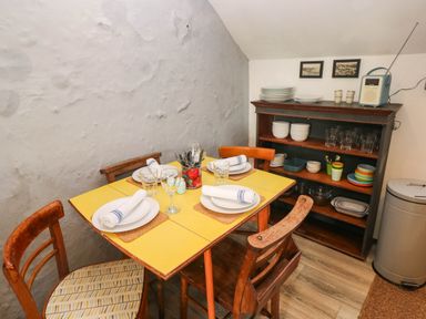 A dining room with a table set for four at Hayloft near Narberth
