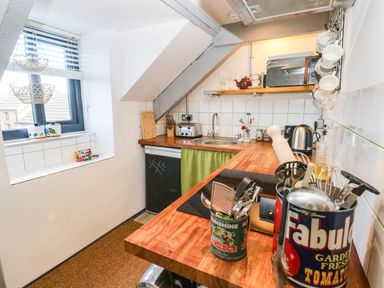 A kitchen with a sink and stove at Hayloft near Narberth