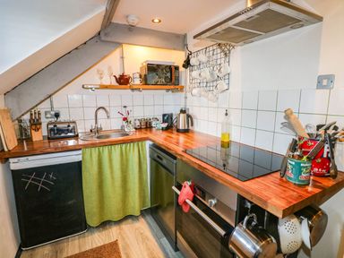 A kitchen with a sink and cooking equipment at Hayloft near Narberth