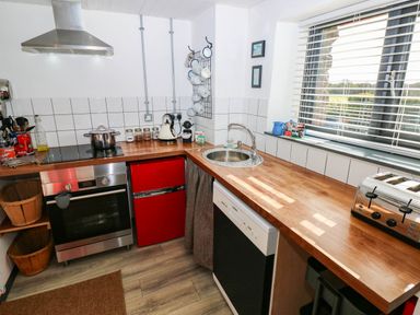 A kitchen with appliances and utensils at Milking Shed near Narberth