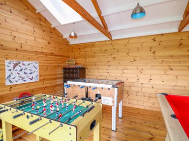 A game room with a foosball table a pool table and an air hockey table at Kingcup Cottage in St Columbus Major